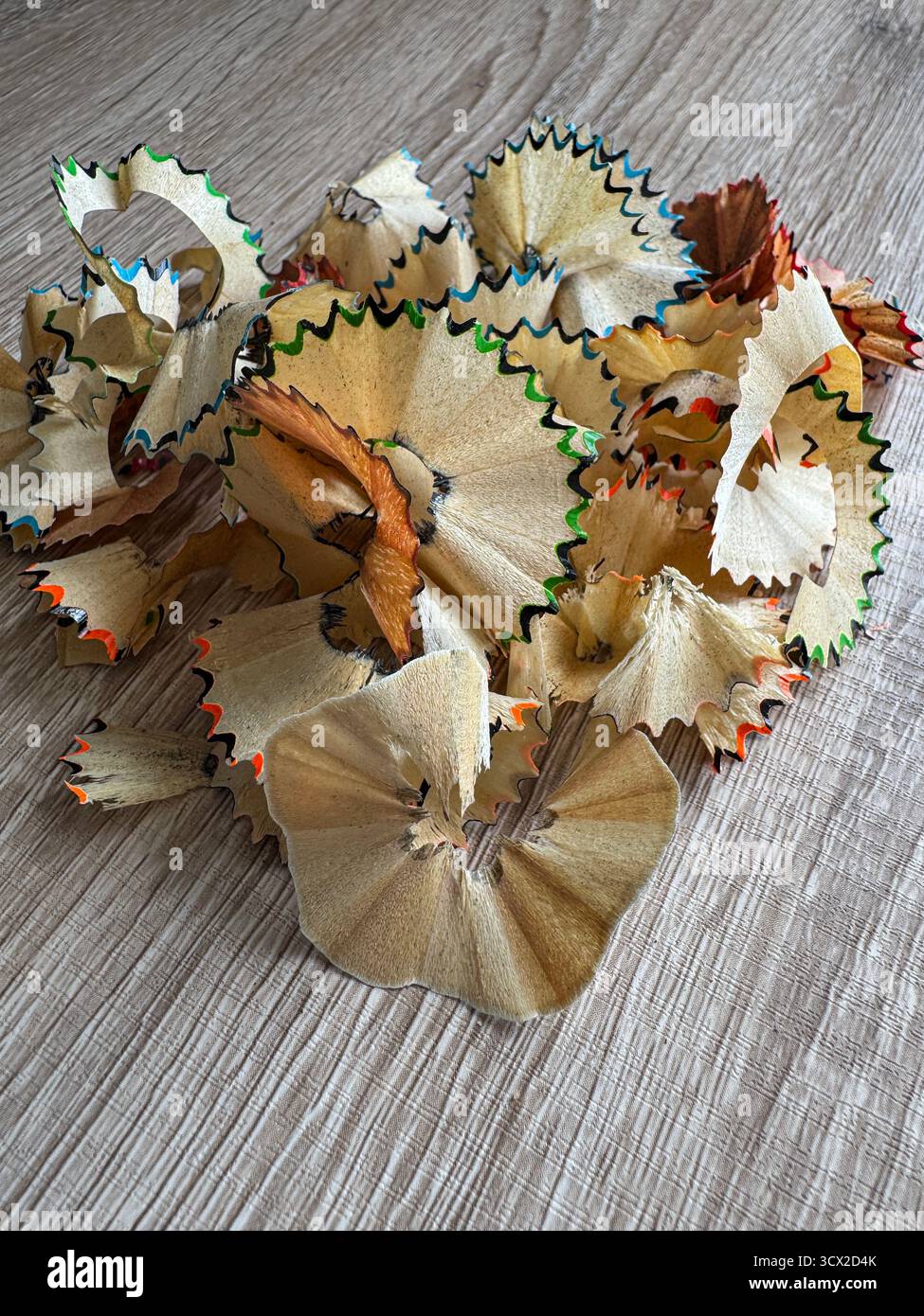 Coloured pencil shavings on a table - Smartphone Captured Stock Image