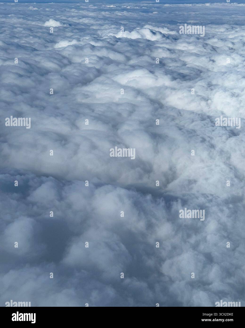 Flying above the clouds from OR Tambo airport to King Shaka airport in South Africa - Smartphone Captured Stock Image