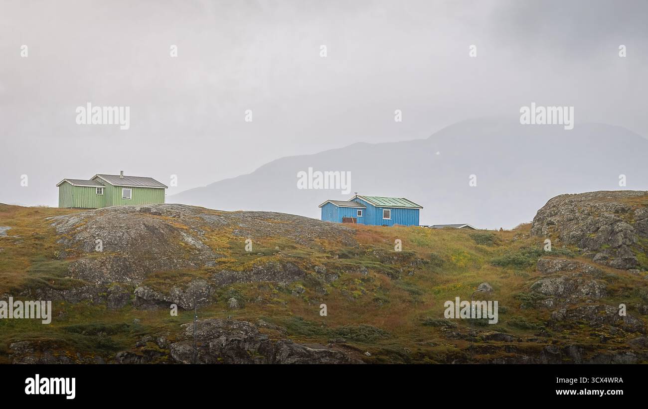 Settlement of Narsaq, Greenland, a stormy day, including shots of Icebergs in the Harbour, August 2025. Stock Photo