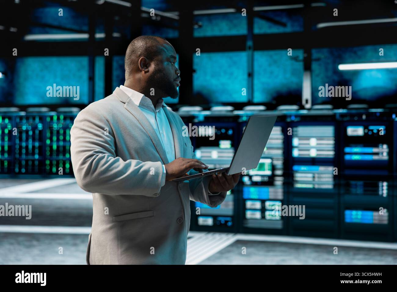 Data center admin running system diagnostic tests and error checking utilities to identify and resolve problems. IT expert looking for network issues affecting server performance and connectivity Stock Photo