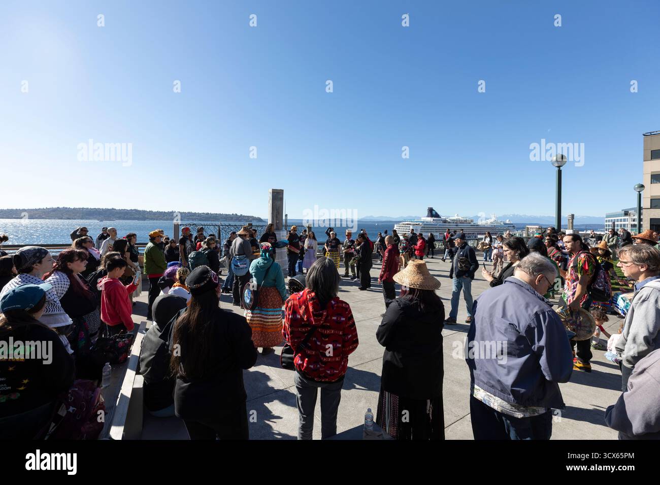 Seattle, Washington, USA. 13th October, 2025. Members of the Muckleshoot Tribe perform a song during a celebration of Indigenous People's Day at Victor Steinbrueck Park along Seattle’s waterfront. Seattle is one of the first U.S. cities to honor the presence of its Native peoples on this day instead of the traditional celebration of Columbus Day. Credit: Paul Christian Gordon/Alamy Live News Stock Photo