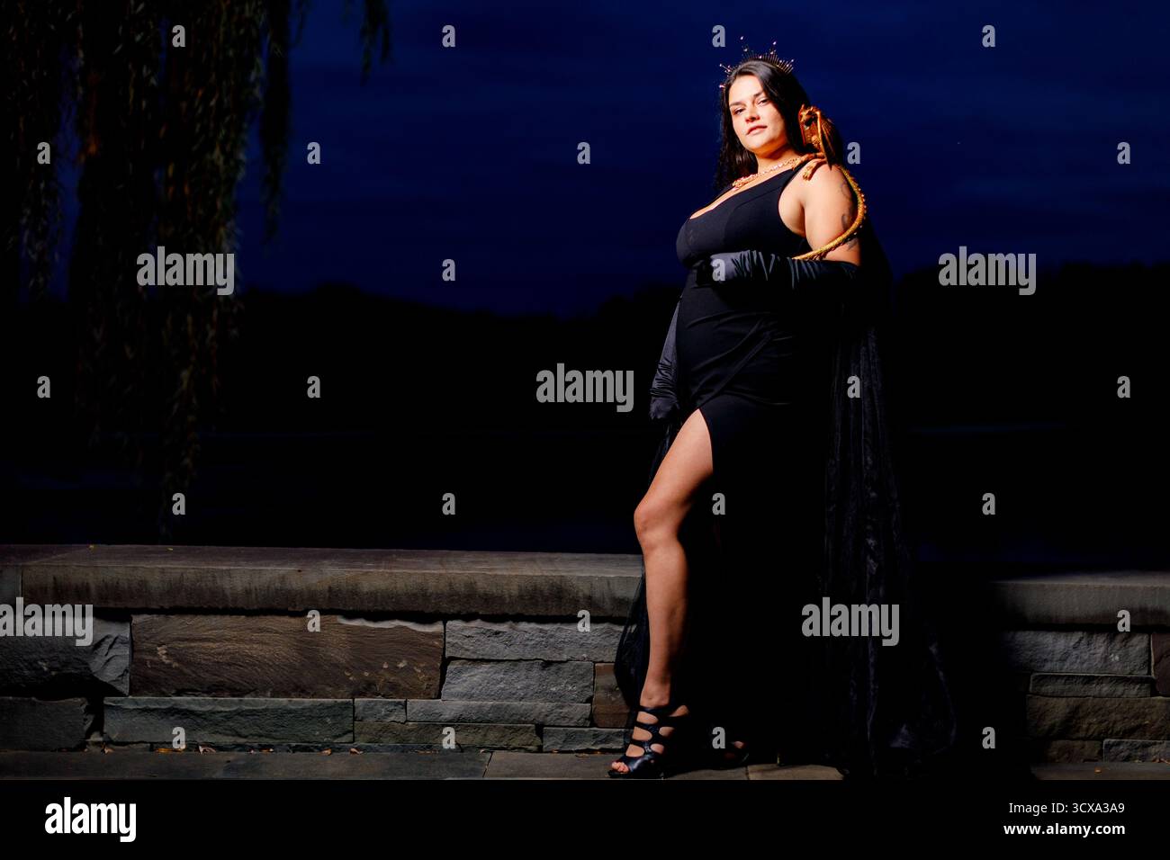 Jenn Wilt, Oneida Indian Nation, as the Dragon Lady of the Ball during a masquerade party. Jenn has designed sneakers for Nike's N7 brand. Stock Photo