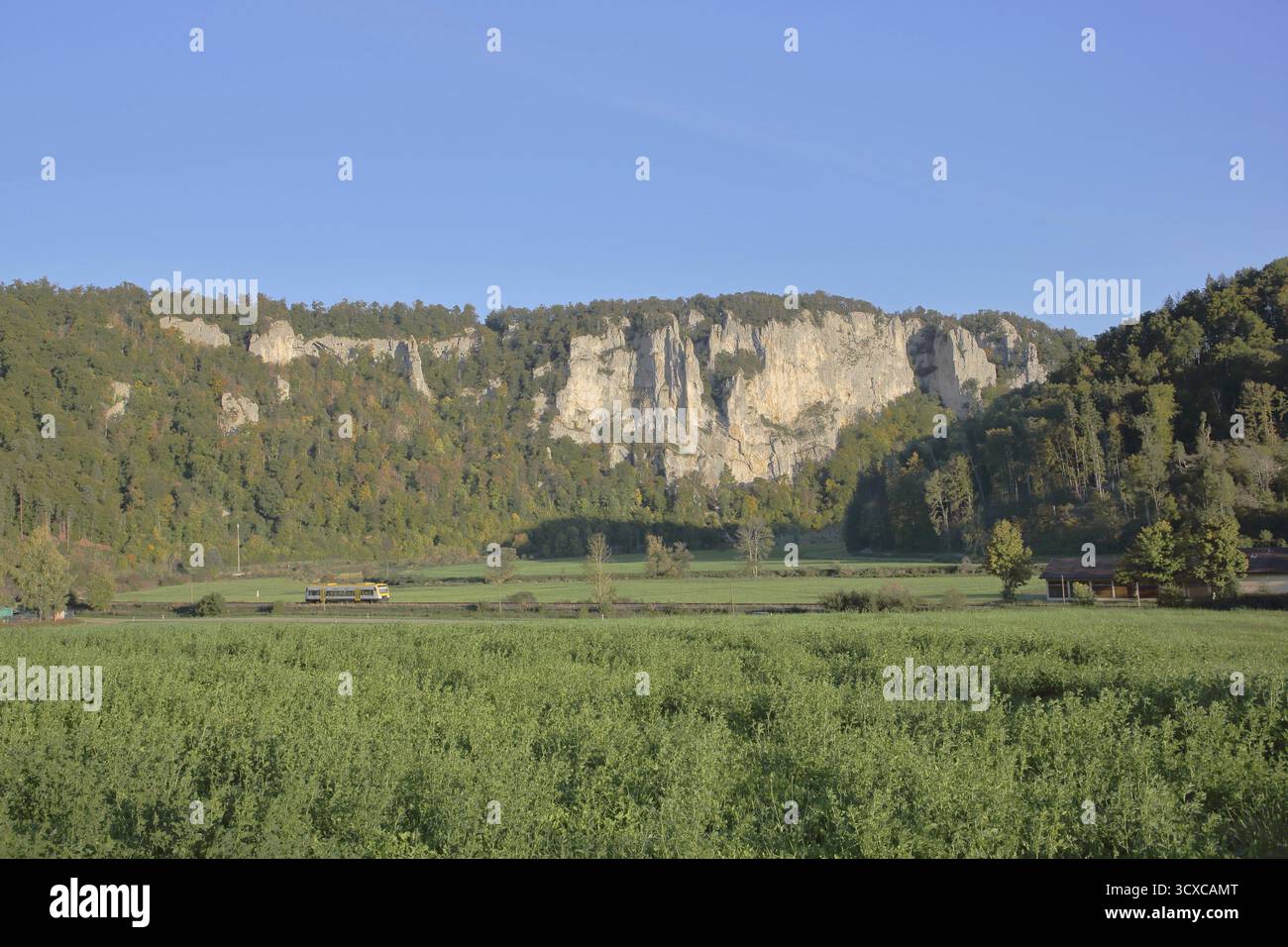 Railway line with train and view of rock formations, landscape, rock ...