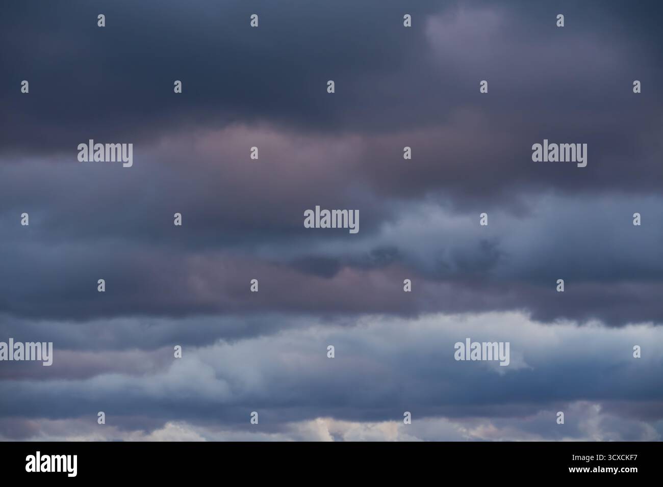 Dramatic storm clouds fill hi-res stock photography and images - Alamy