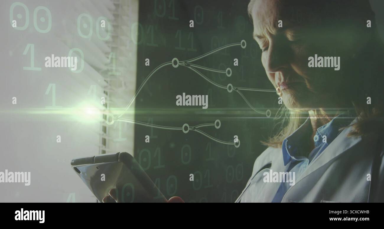 Standing at blinds, senior scientist in lab coat using tablet displaying binary code, copy space Stock Photo