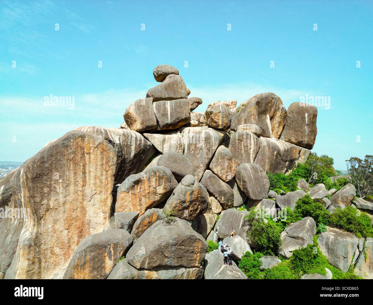Aerial view of the rugged, sun-kissed rocks of Shere Hills jutting ...