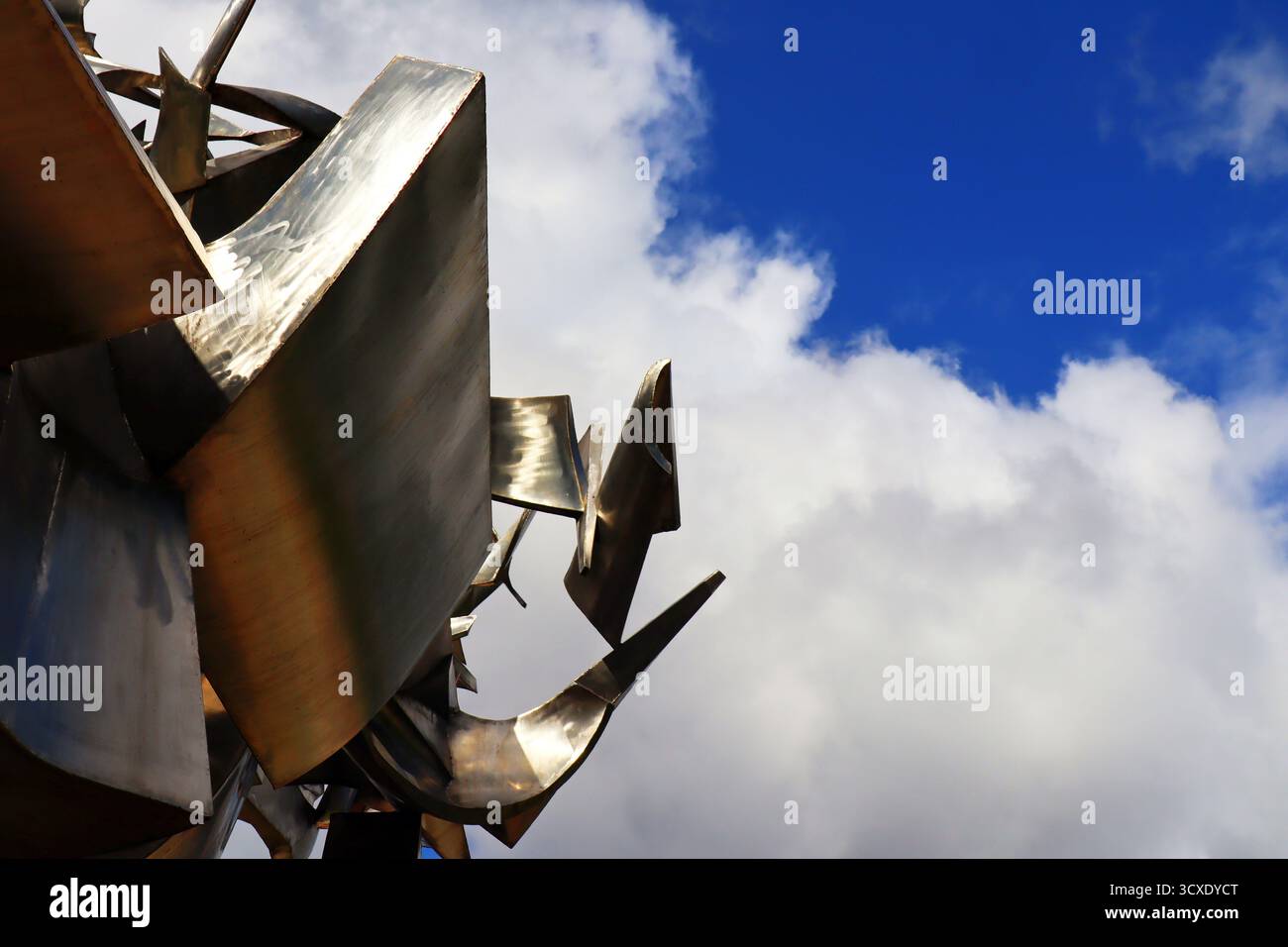 abstract metallic sculpture against blue sky Stock Photo