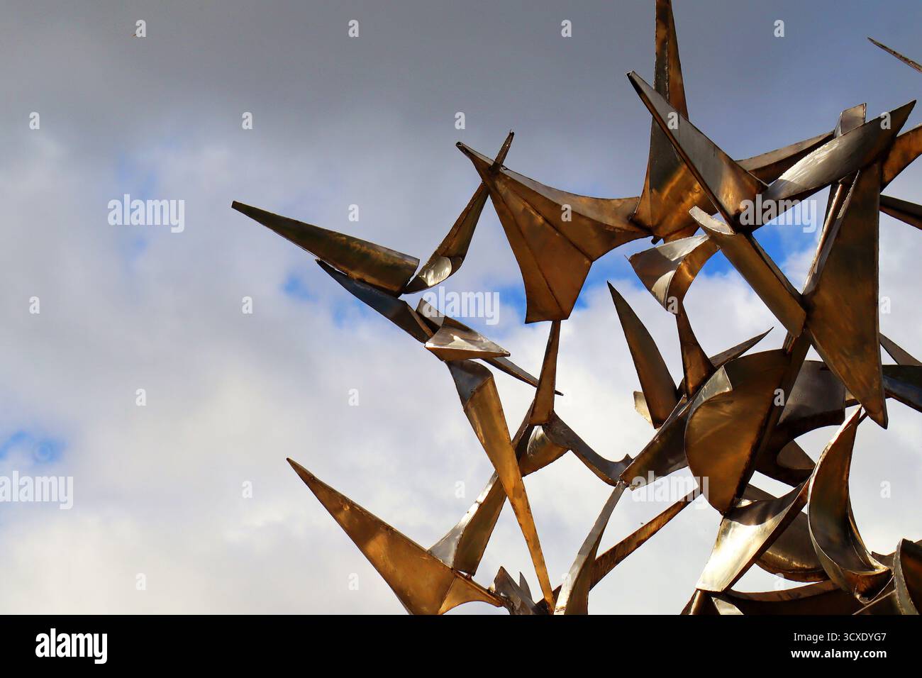 abstract metallic sculpture against blue sky Stock Photo