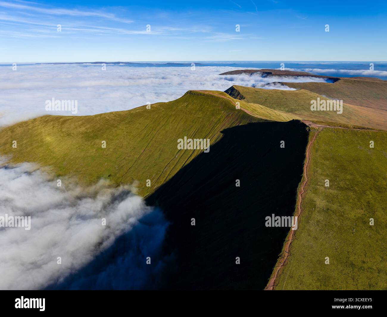 Aerial drone view of a temperature inversion over Pen-y-Fan summit in ...