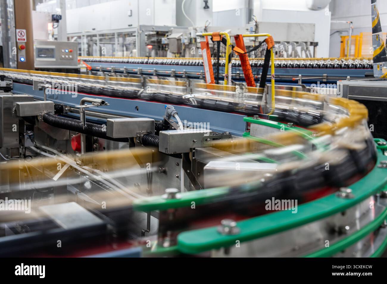 Bottles of Coca-Cola moving on a production line at the Swire Coca-Cola ...