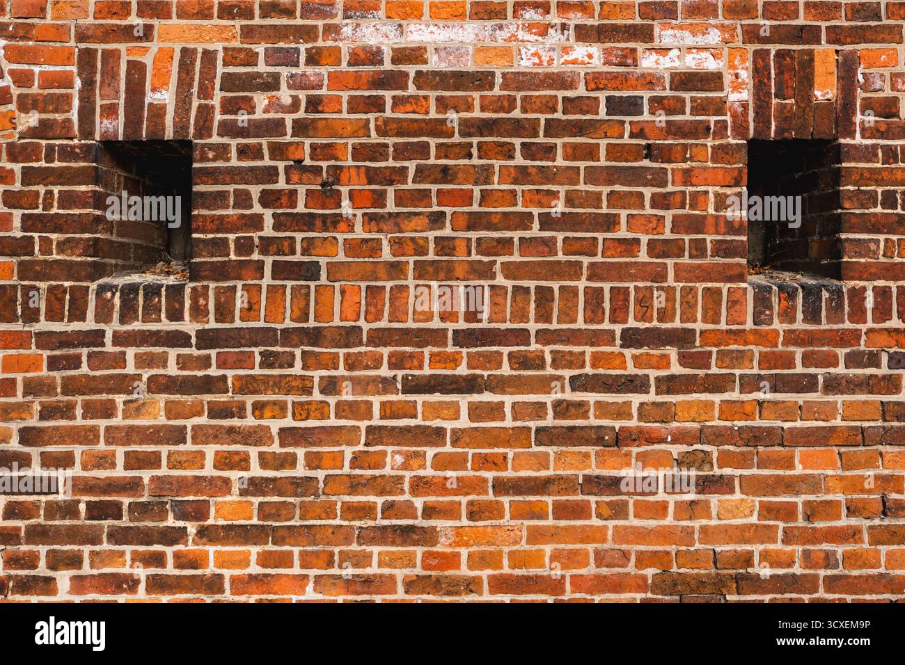 Texture of a medieval wall made from orange bricks Stock Photo
