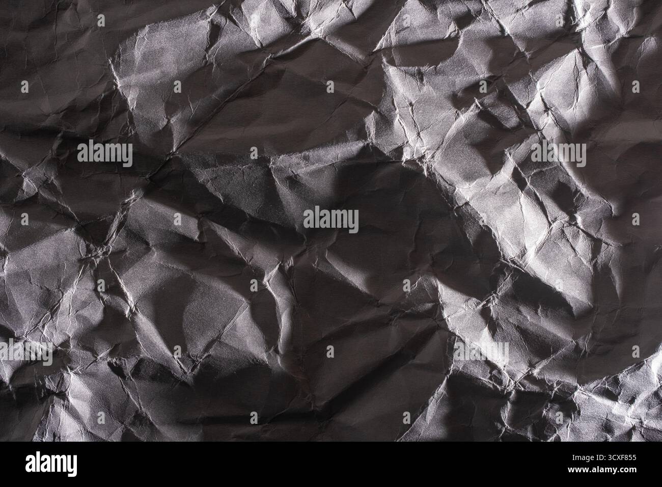 Grey crumpled paper texture. Abstract background and texture for design Stock Photo