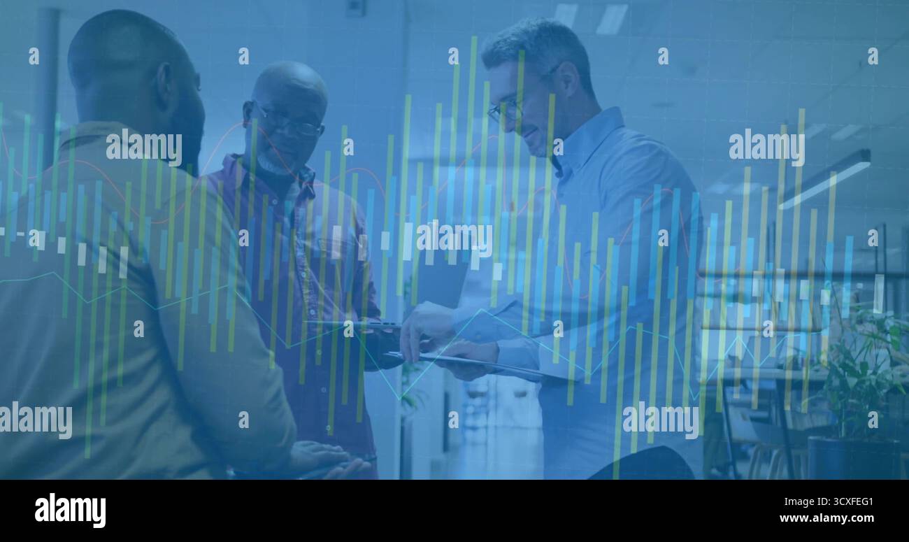 Analyzing three professionals wearing business attire using tablet in office with digital charts Stock Photo