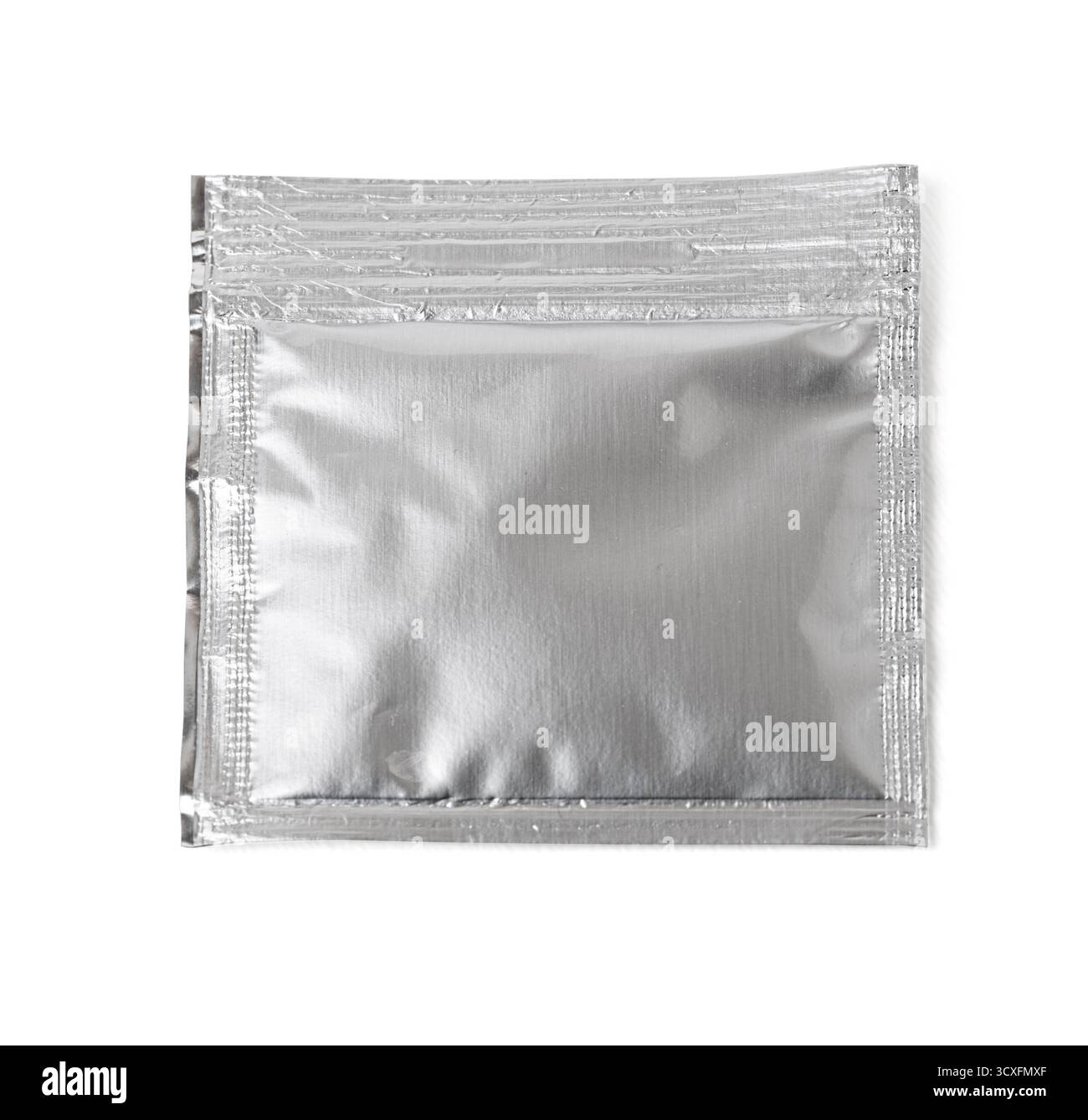 Sealed silver foil sachet providing airtight packaging for various products Stock Photo