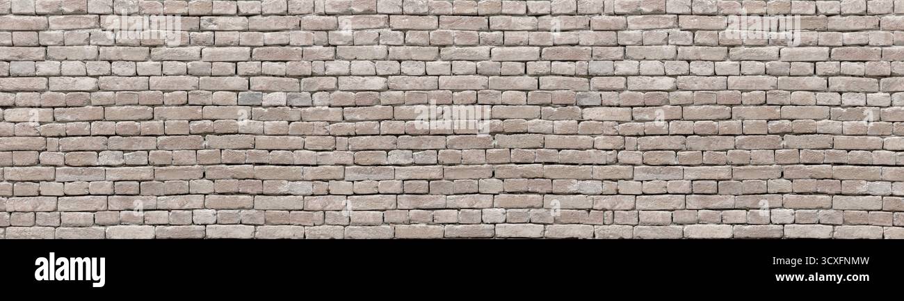 Old brown brick wall presenting a textured pattern for backgrounds Stock Photo