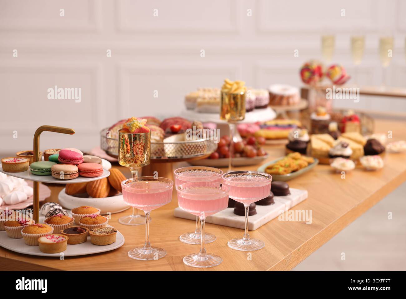 Buffet menu. Delicious desserts and drinks on table, selective focus Stock Photo