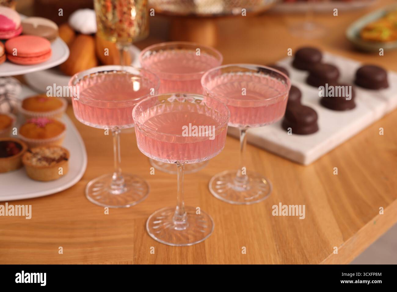 Buffet menu. Delicious desserts and drinks on table, selective focus Stock Photo