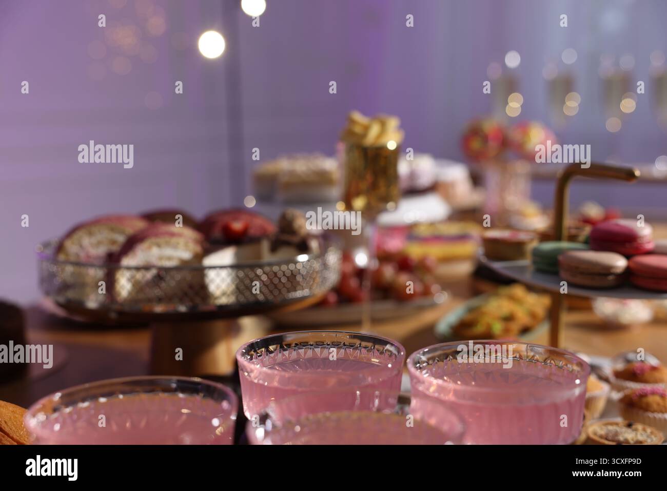 Buffet menu. Delicious desserts and drinks on table, selective focus Stock Photo
