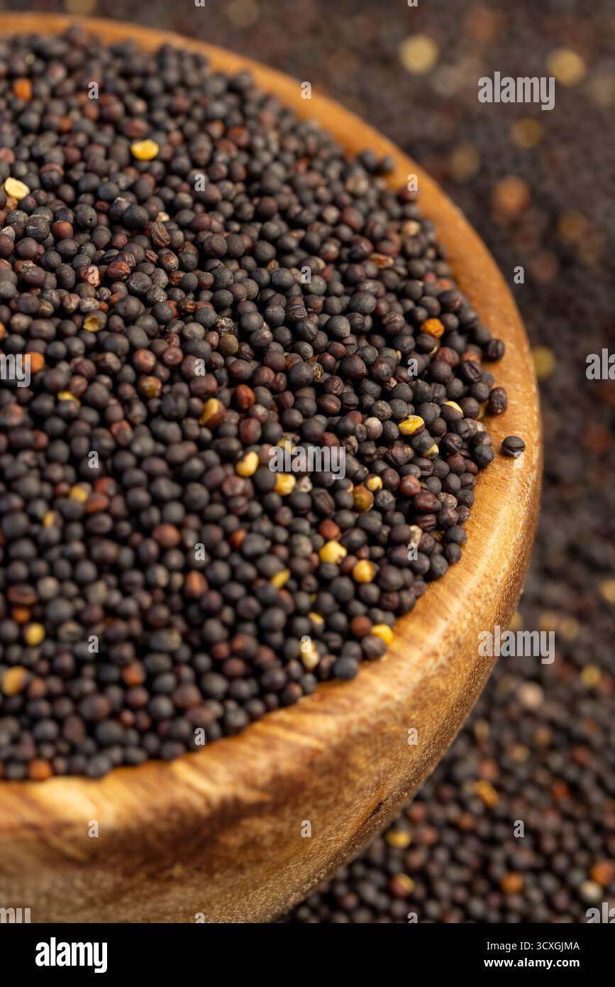 Rapeseed Shell black rapeseed is used to produce food products, round wooden bowl ...