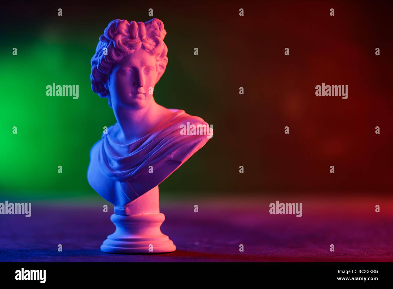 Decorative Plaster Head in Blue Red Gradient Light Installation Stock Photo