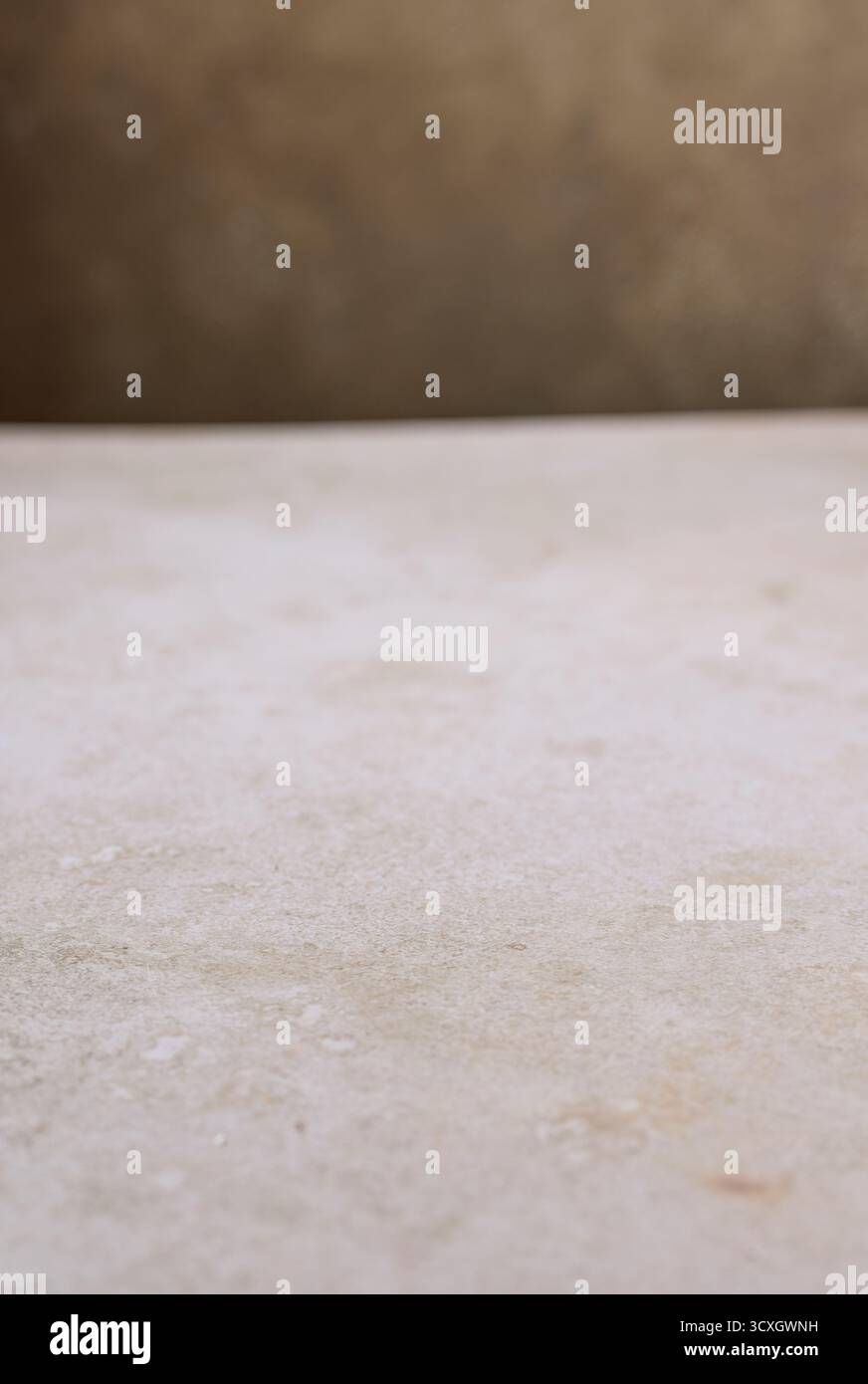 beige table texture and brown wall background Stock Photo