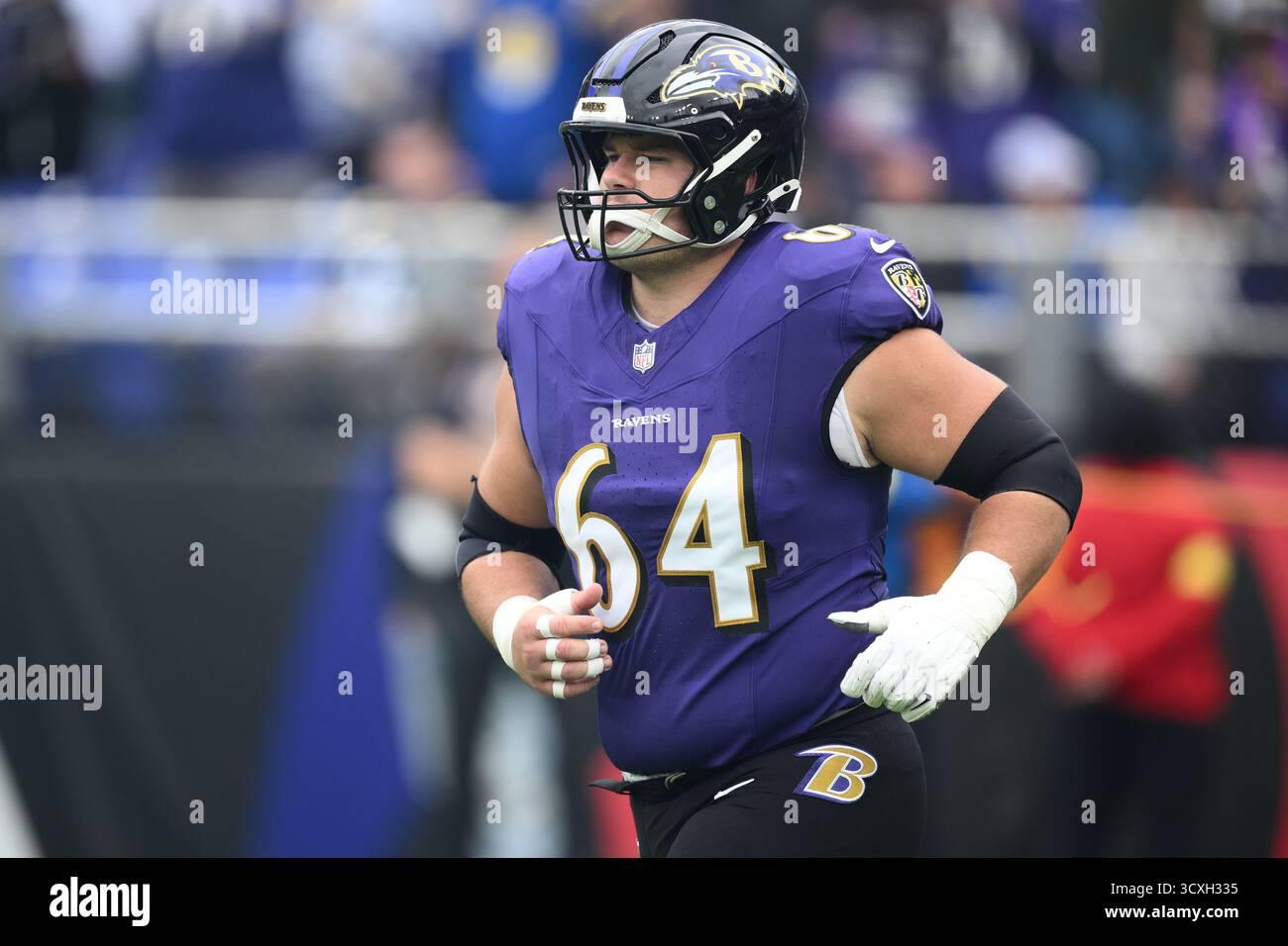 Tyler Linderbaum Baltimore Ravens center Tyler Linderbaum (64) takes to the field before ...
