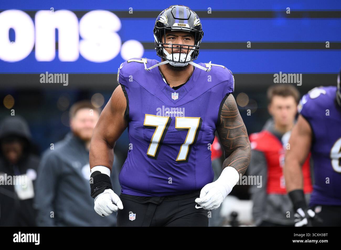 Baltimore Ravens guard Daniel Faalele (77) warms up before an NFL ...