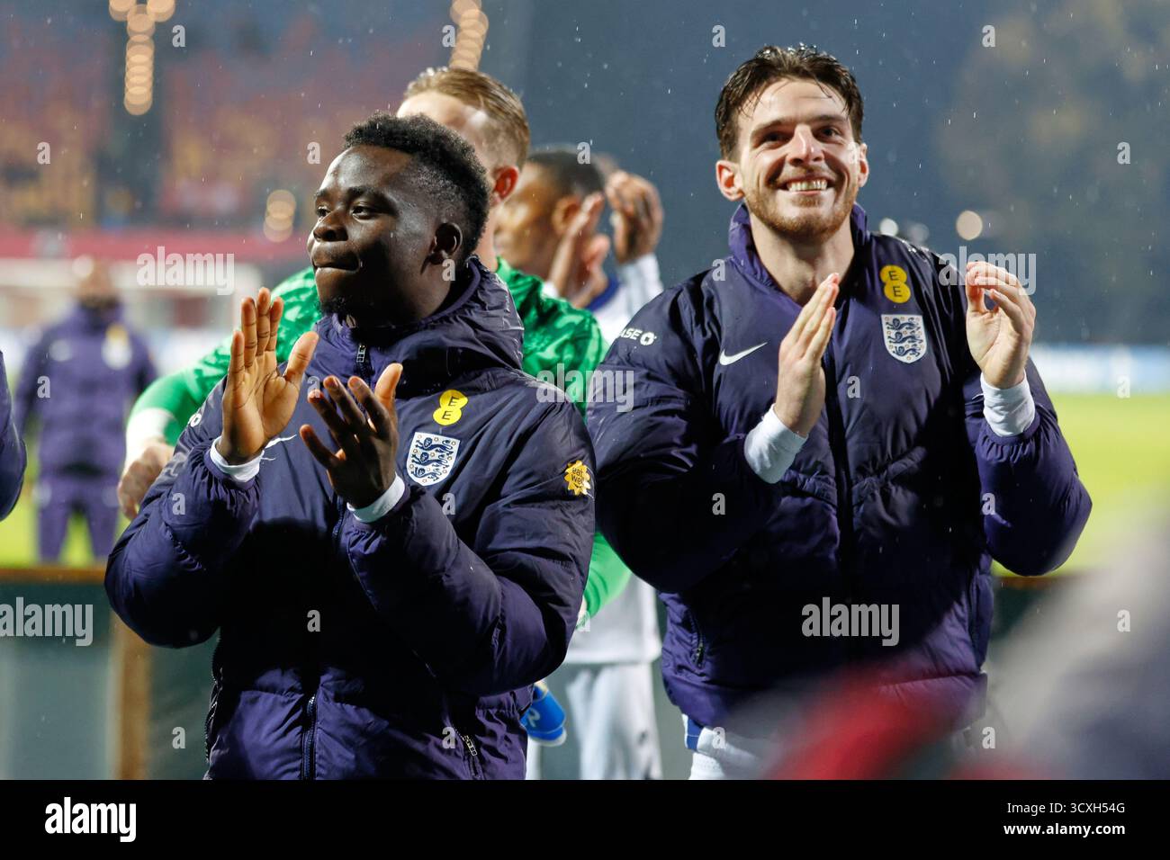 England's Bukayo Saka, left, and Declan Rice applaud England's ...