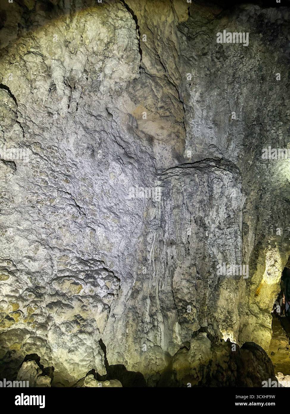 Close-up view of textured limestone walls illuminated inside the Ice Cave in Uvac Canyon, Serbia, showcasing natural karst formations. - Smartphone Captured Stock Image