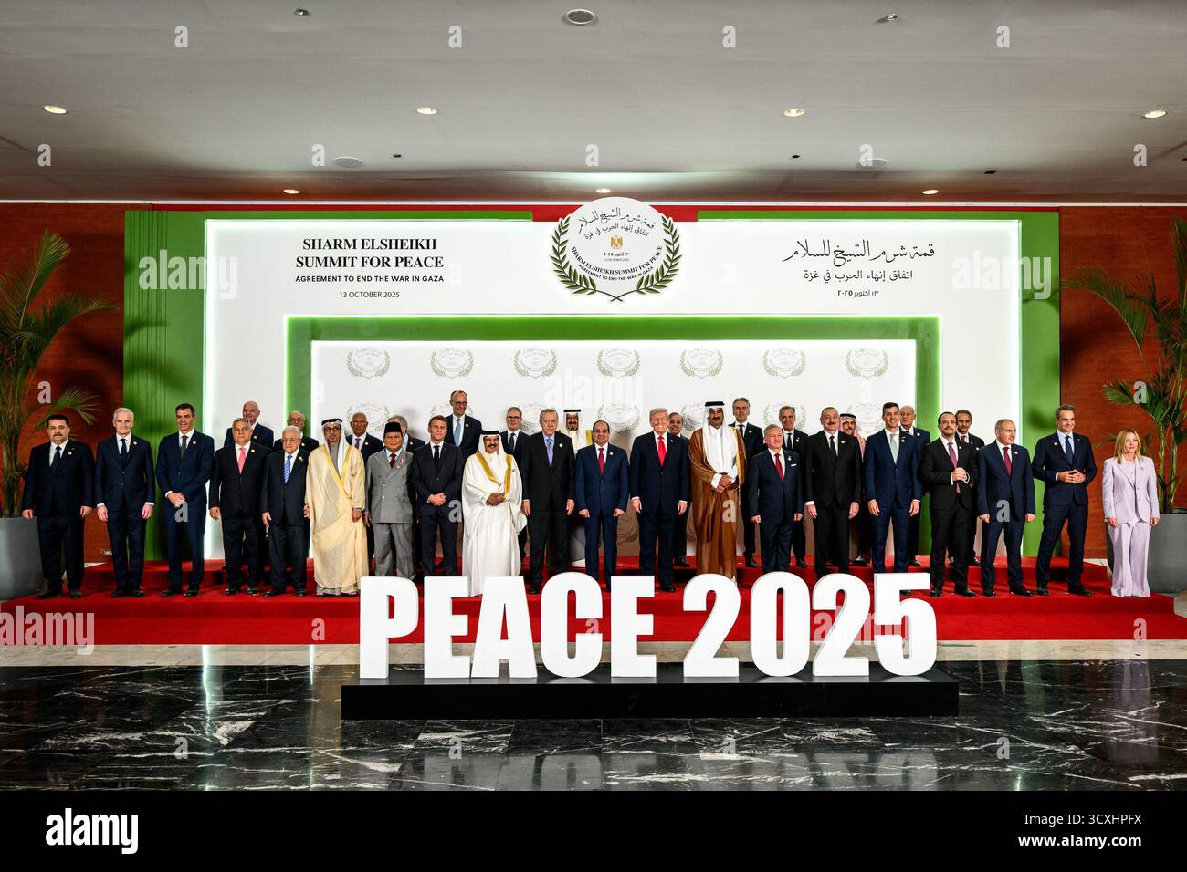 President Donald Trump poses for a family photo with world leaders at the Tonino Lamborghini International Convention Center in Sharm El Sheikh, Egypt, Monday, October 13, 2025, during a summit on ending the war in Gaza and advancing peace in the Middle East. (Official White House Photo by Daniel Torok) Stock Photo