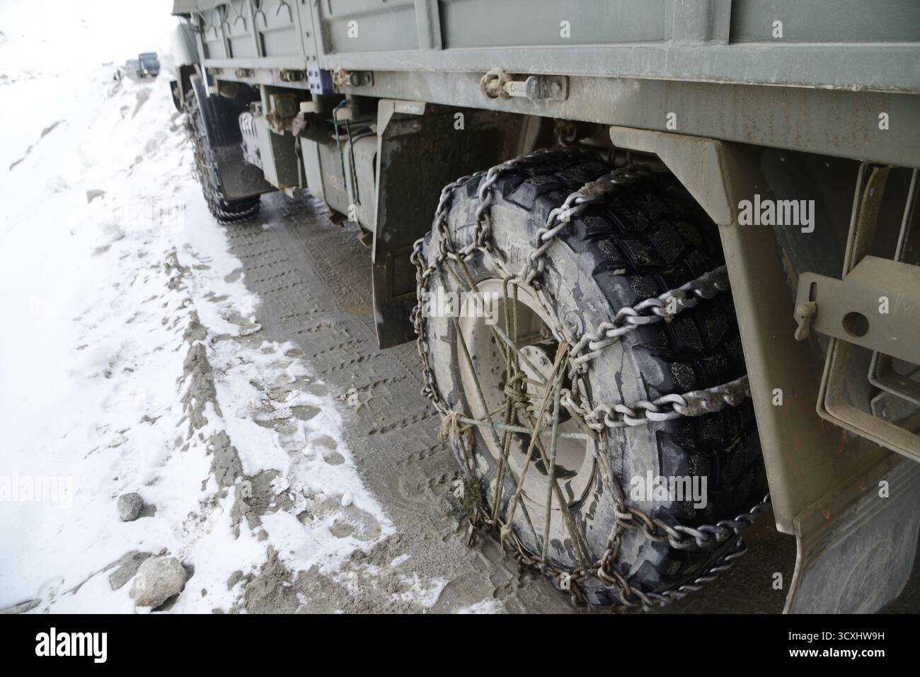 he military truck wheels have chains to prevent slipping and help with ...