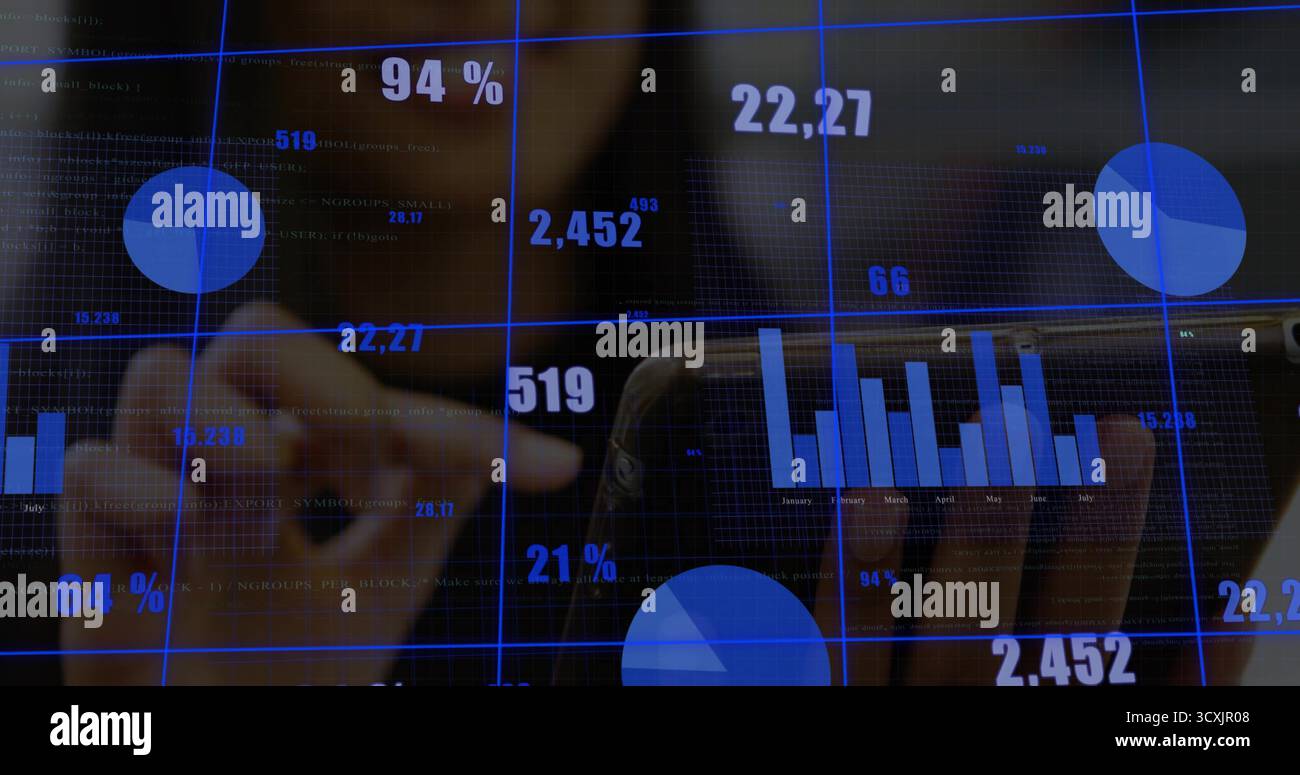 Interacting data analyst wearing jacket tapping touchscreen display in office, with floating charts Stock Photo