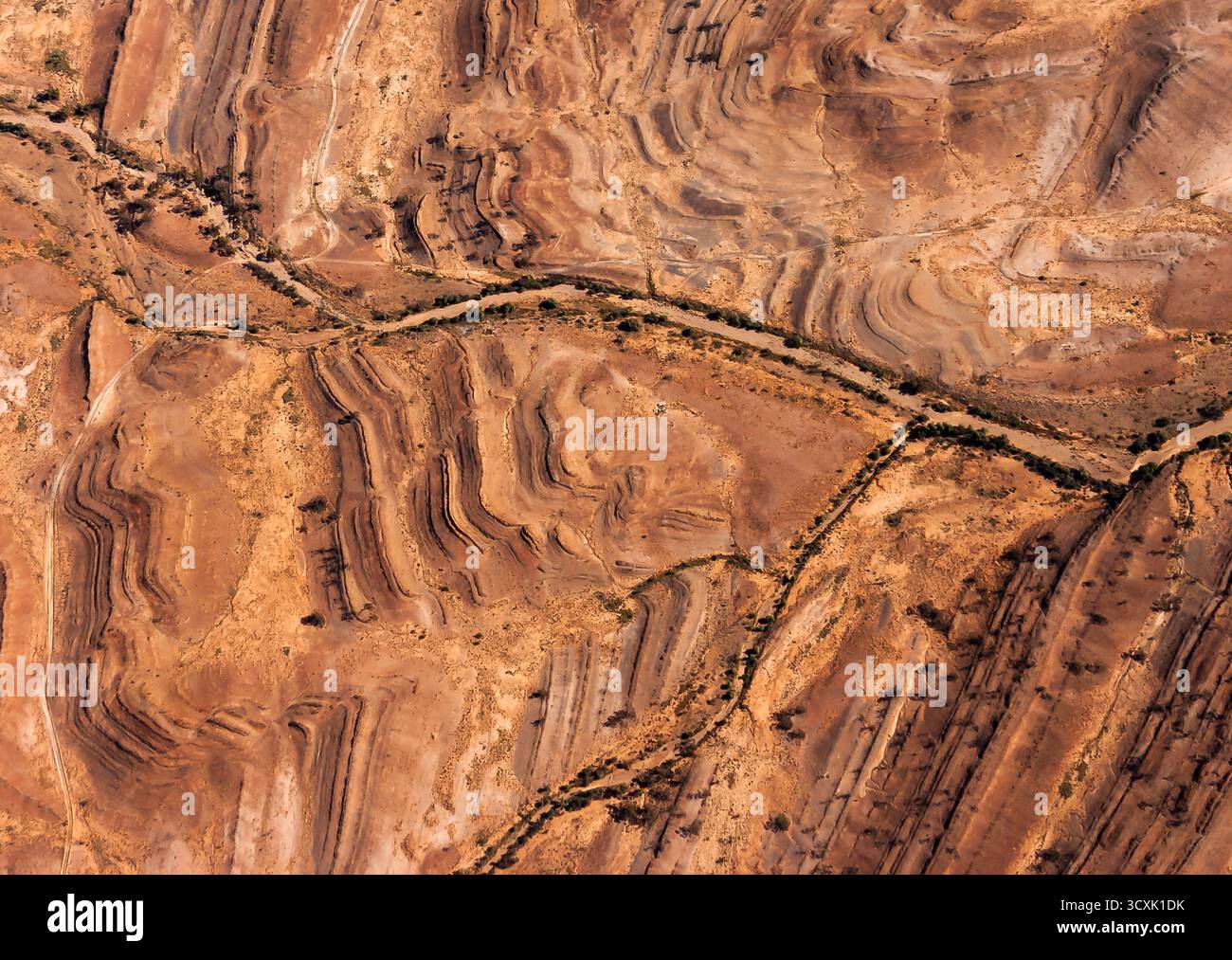 Undulating De Formation Eroded land formations in South Australia's central desert feature ...