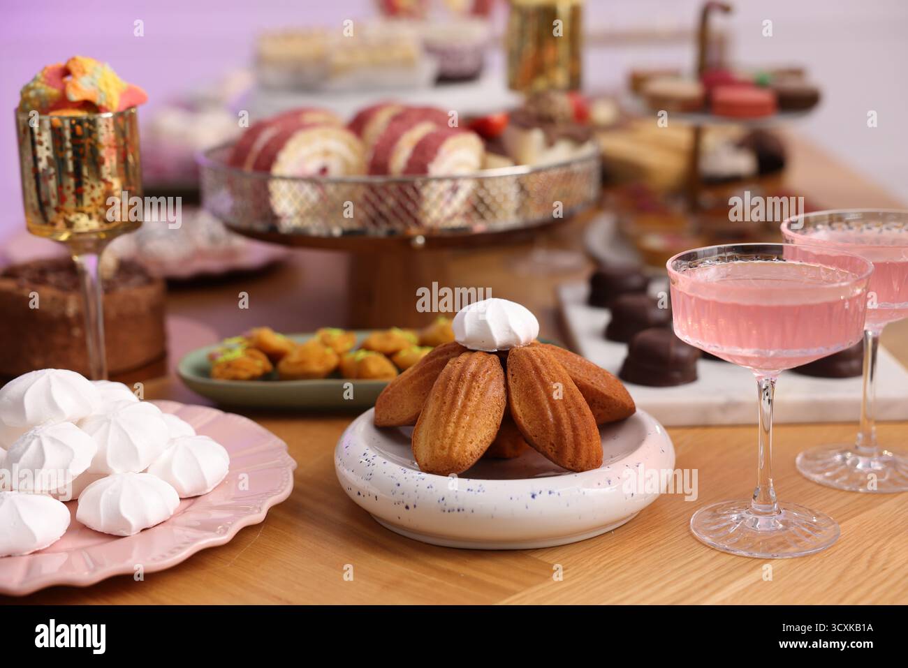 Buffet menu. Delicious desserts and drinks on table, selective focus Stock Photo
