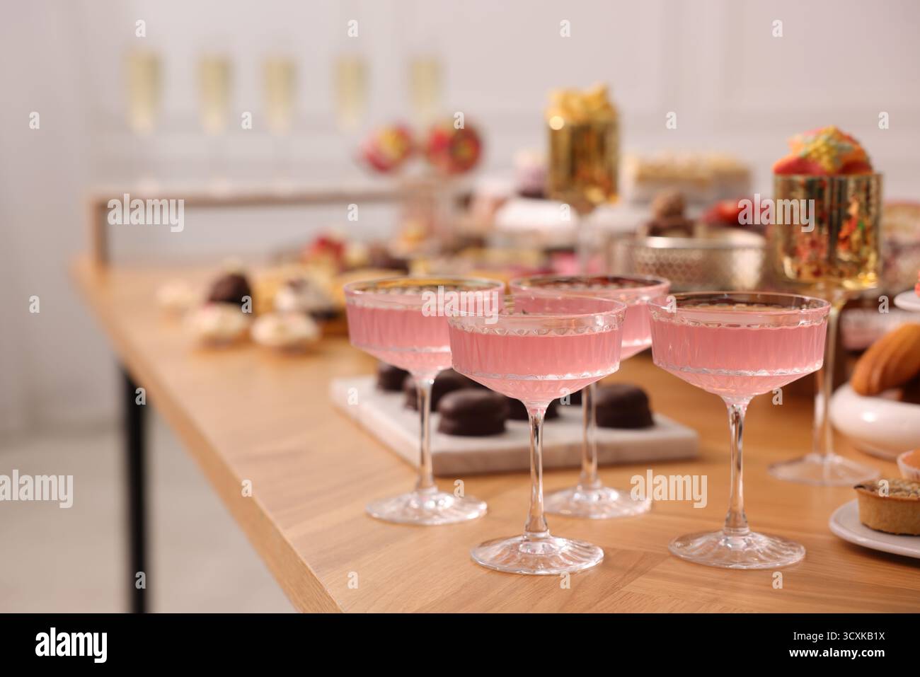 Buffet menu. Delicious desserts and drinks on table, selective focus Stock Photo