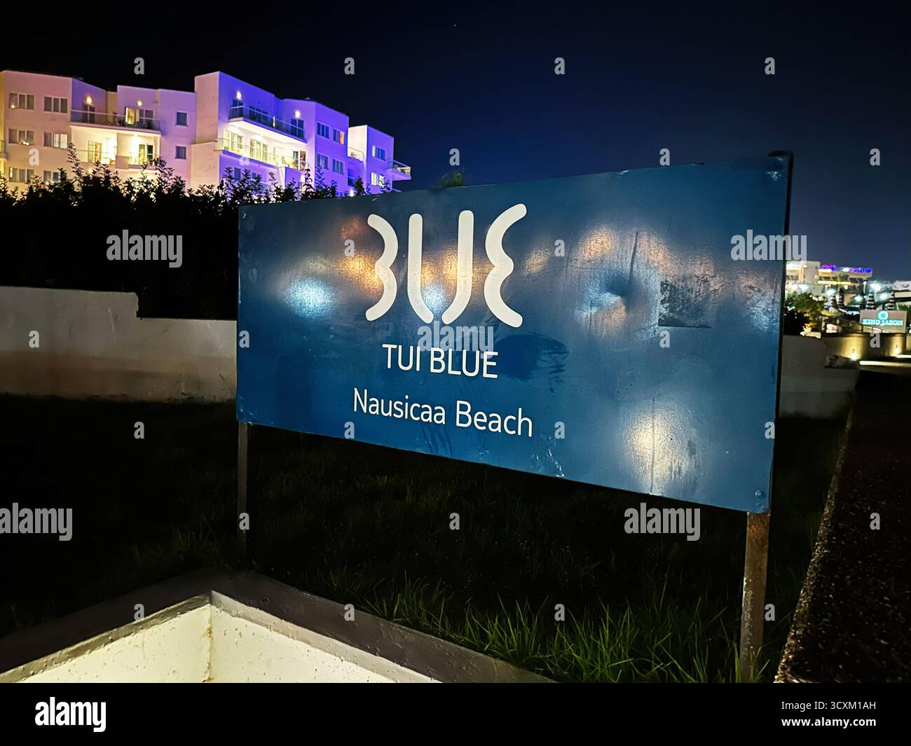 Protaras, Cyprus - July 18, 2024: A blue hotel sign glows at night ...