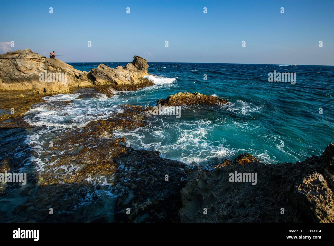 Isla Mujeres, Cancun, Mexico Rocky shoreline with a body of water in ...