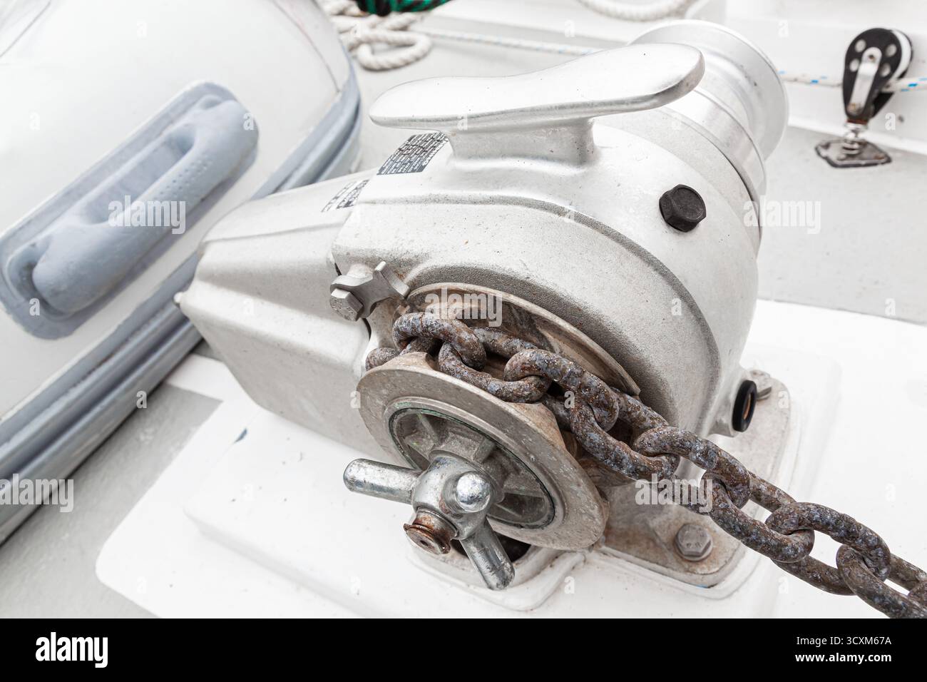 Anchor winch with a chain on a yacht, close-up Stock Photo