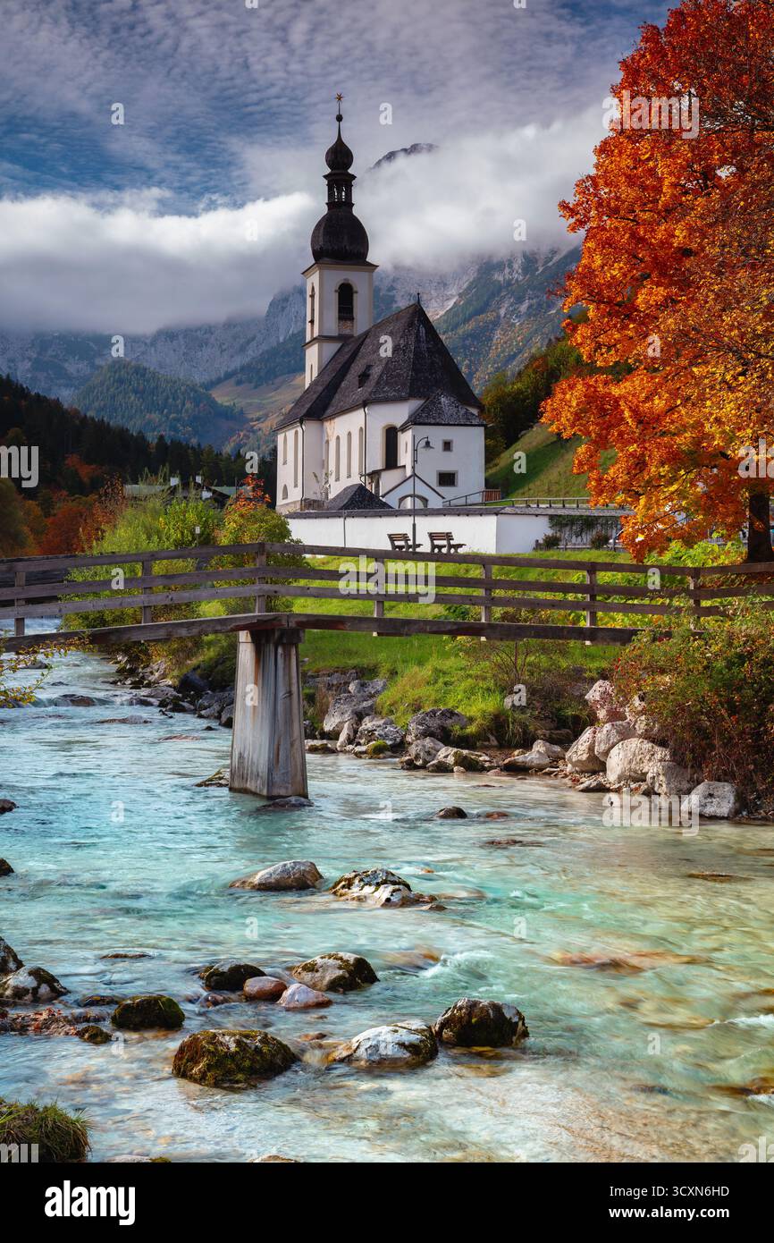 Autumn in Alps. Landscape image of the Bavarian Alps with Parish Church of St. Sebastian located in Ramsau bei Berchtesgaden, Germany during beautiful Stock Photo