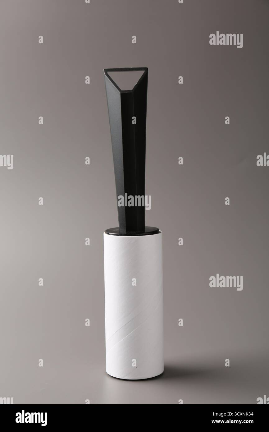 One sticky lint roller on grey background Stock Photo