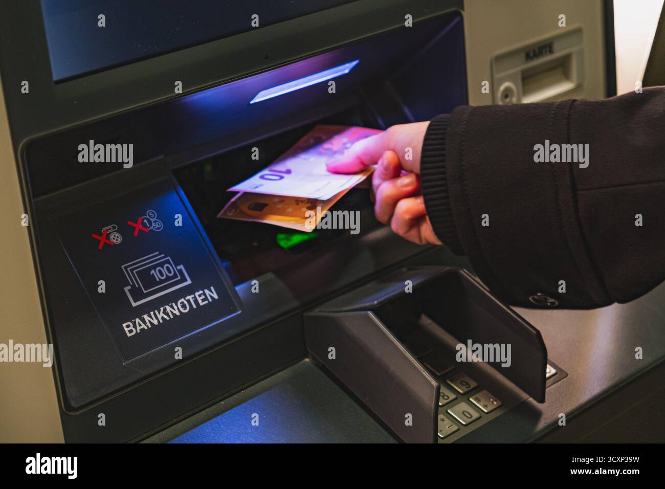 Customer using cash machine hi-res stock photography and images - Alamy