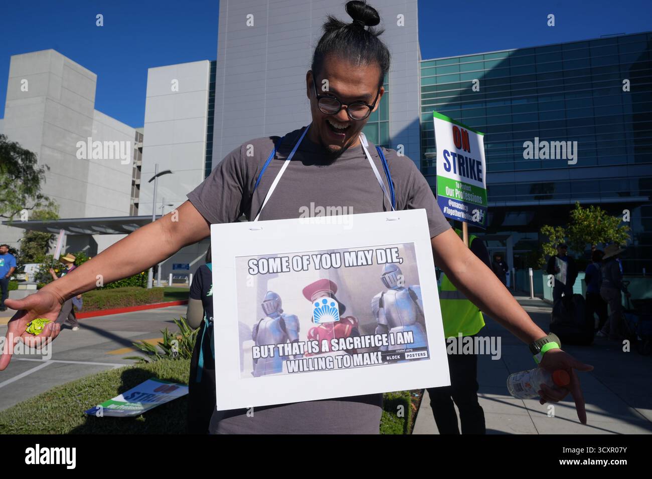 Kaiser Permanente health care workers hold signs while on strike in ...