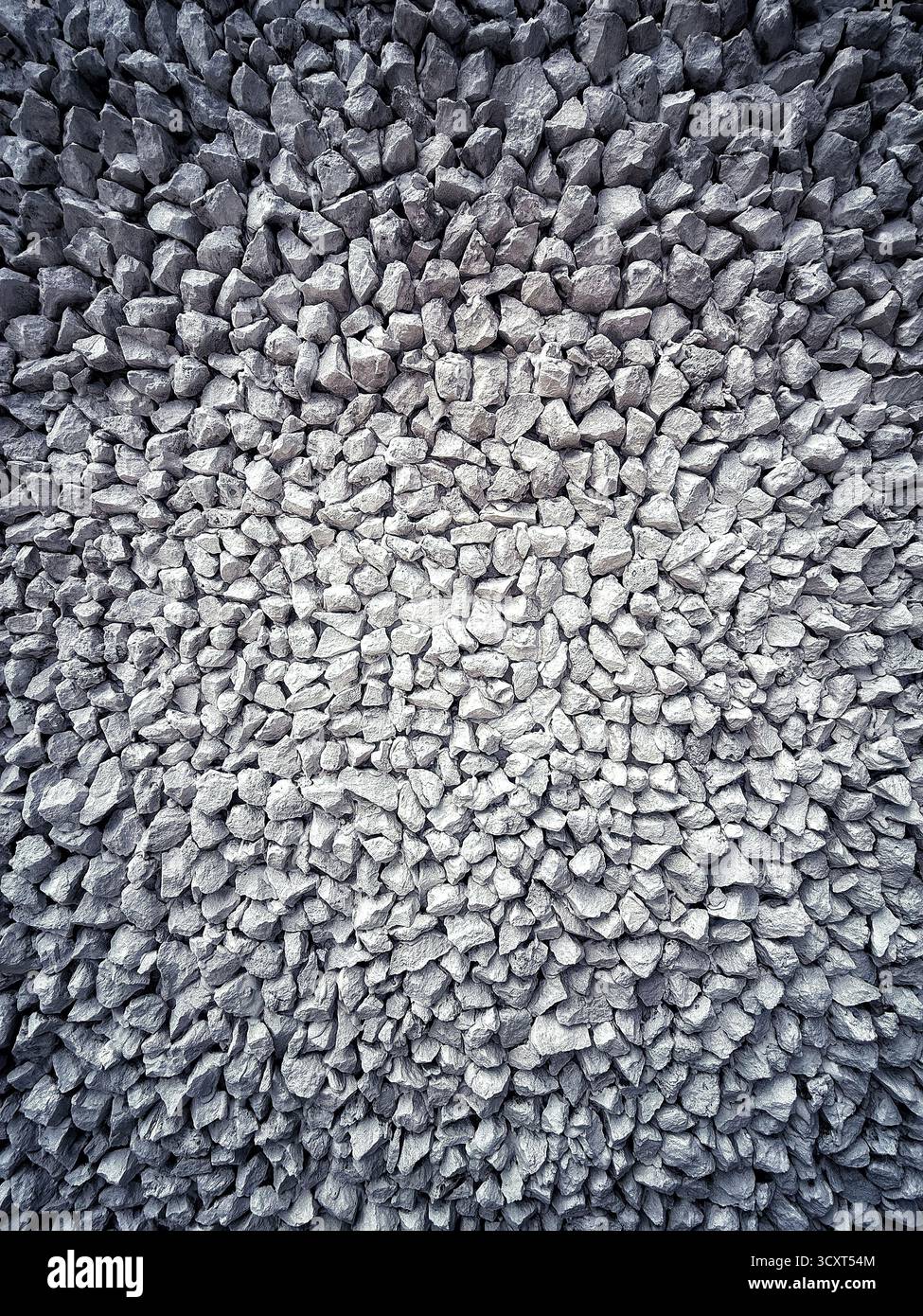High angle view of closely packed textured stones forming an abstract and uniform pattern - Smartphone Captured Stock Image