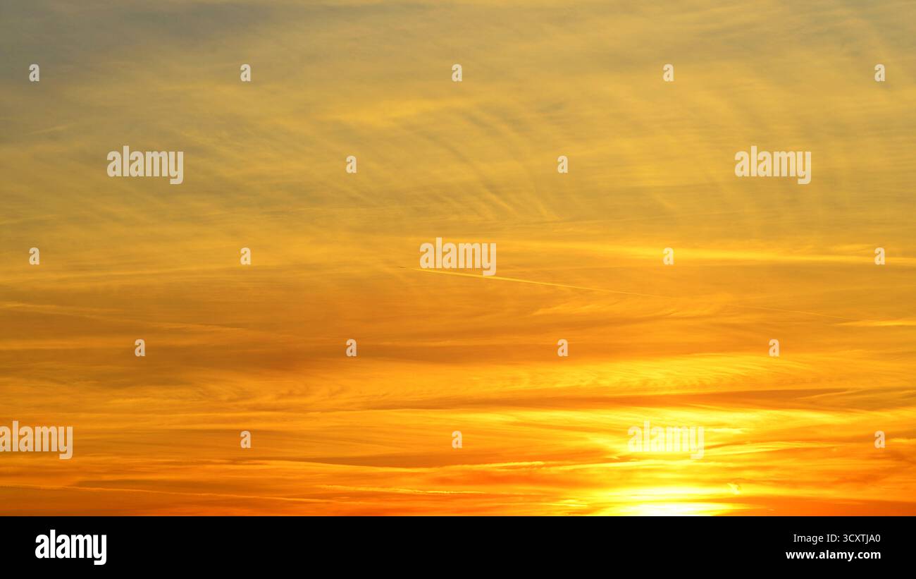 Sunset sky background with orange and yellow colors. Beautiful sunset ...