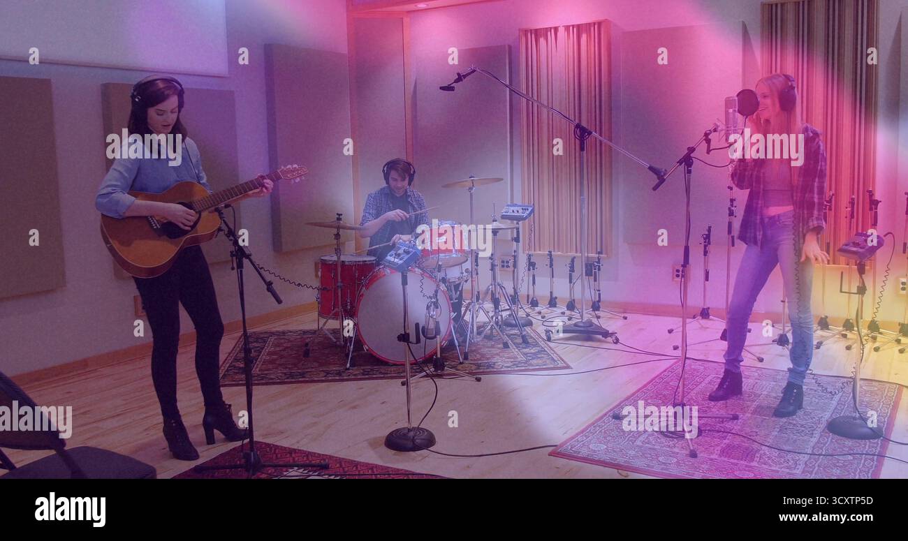 Recording three musicians strumming guitar, playing drums, singing in ...