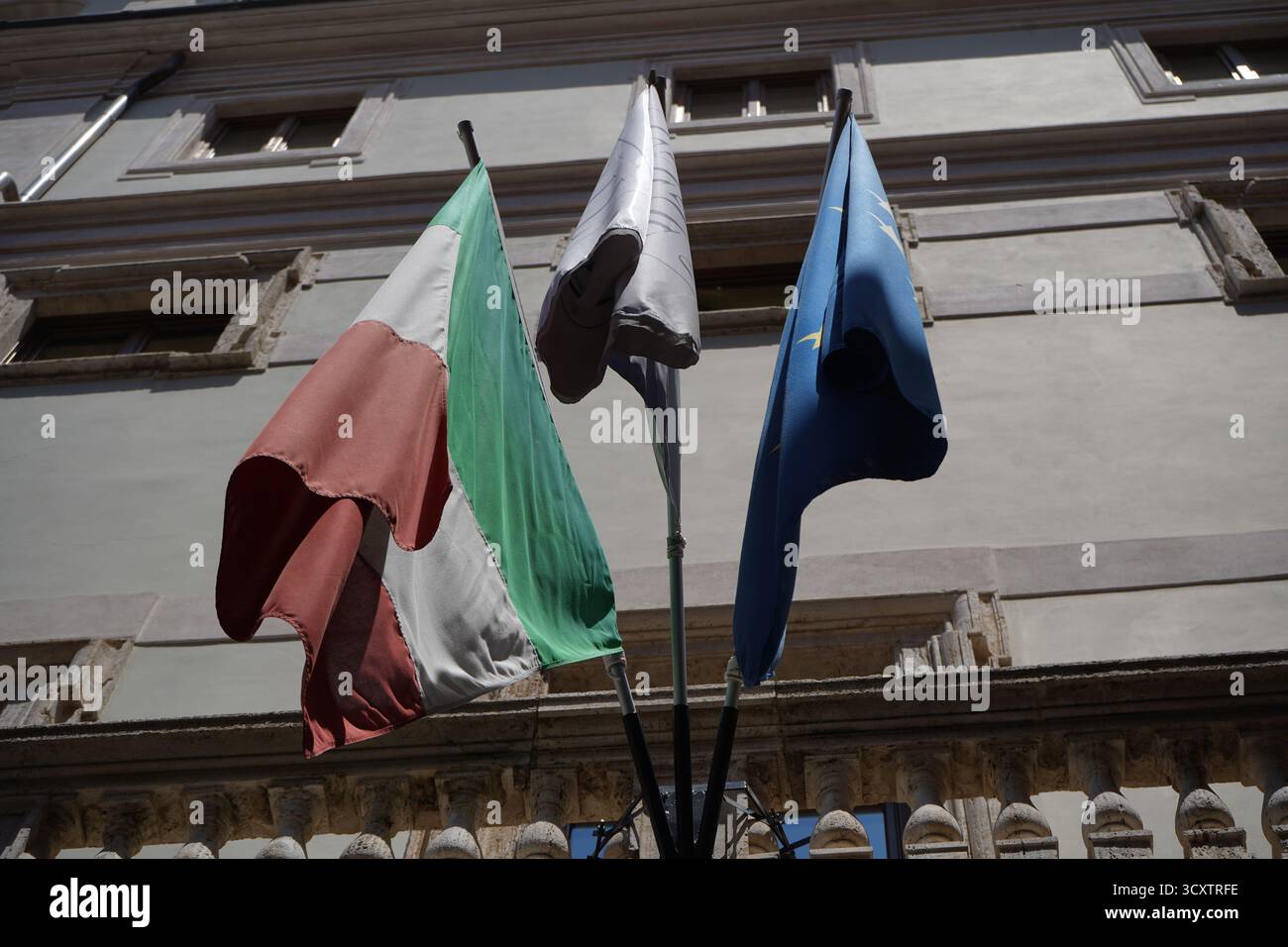 Italian Union Three flags, including the Italian and European Union, displayed at the ...