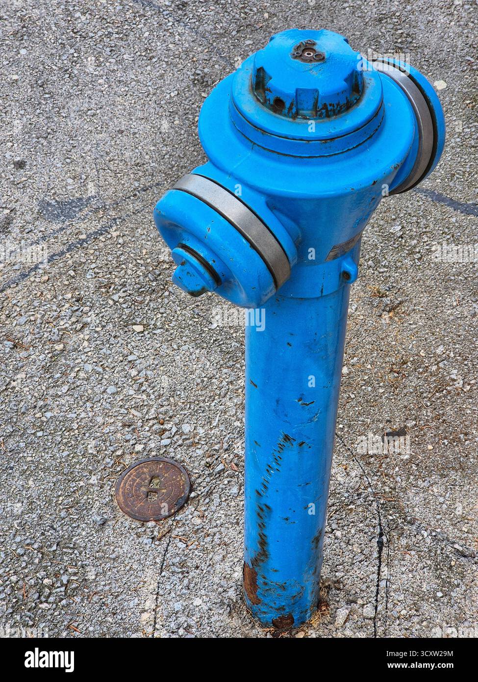 old blue metal hydrant on the ground - Smartphone Captured Stock Image