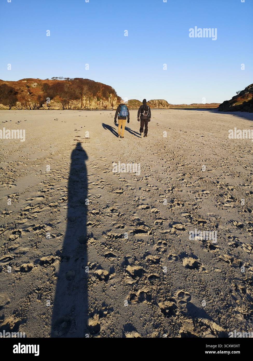 Walking the sandy tidal causeway to Erraid Island, Ross of Mull, Scotland—Kidnapped location linked to Robert Louis Stevenson and David Balfour. - Smartphone Captured Stock Image