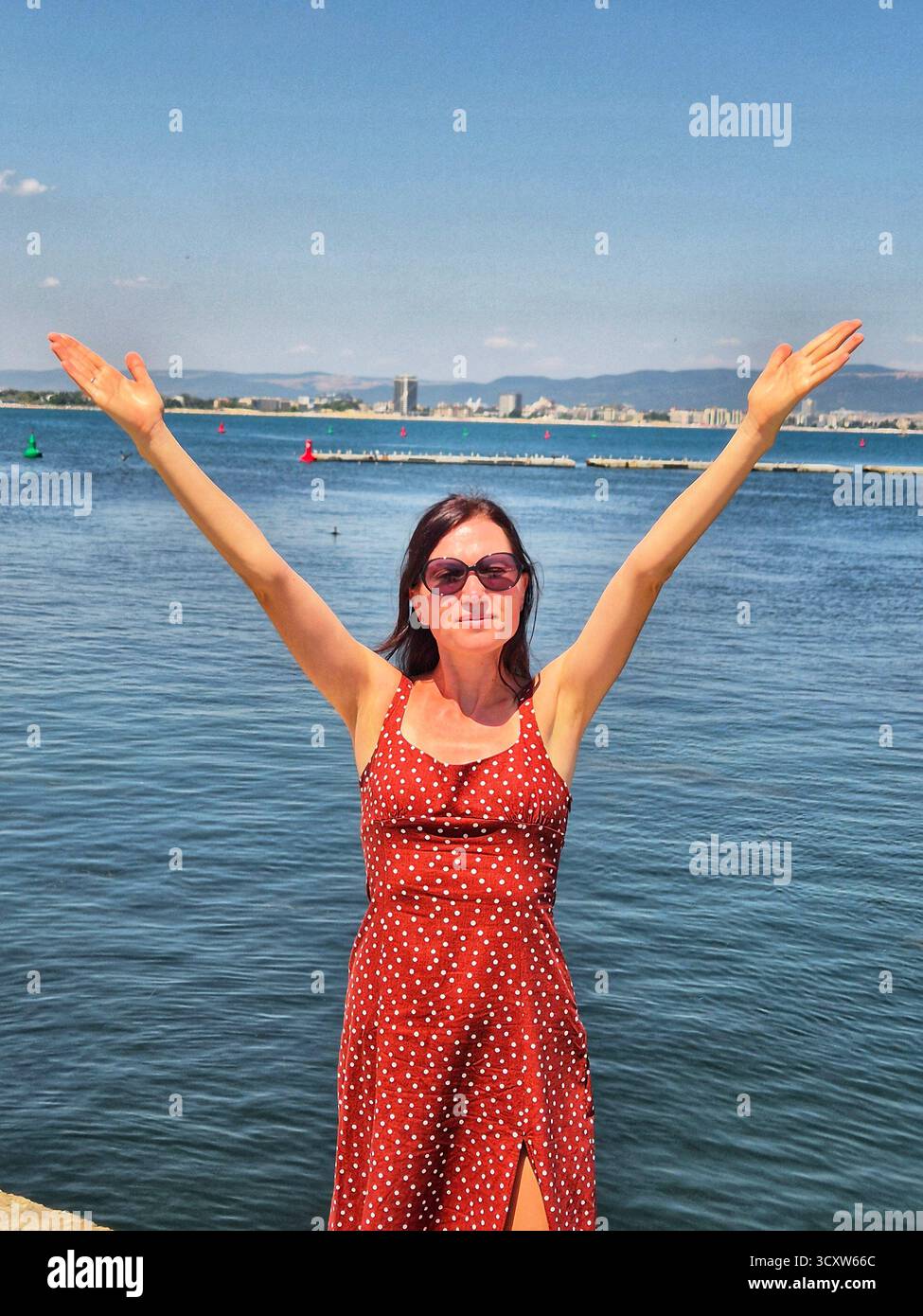 woman on the background of a sea panorama - Smartphone Captured Stock Image