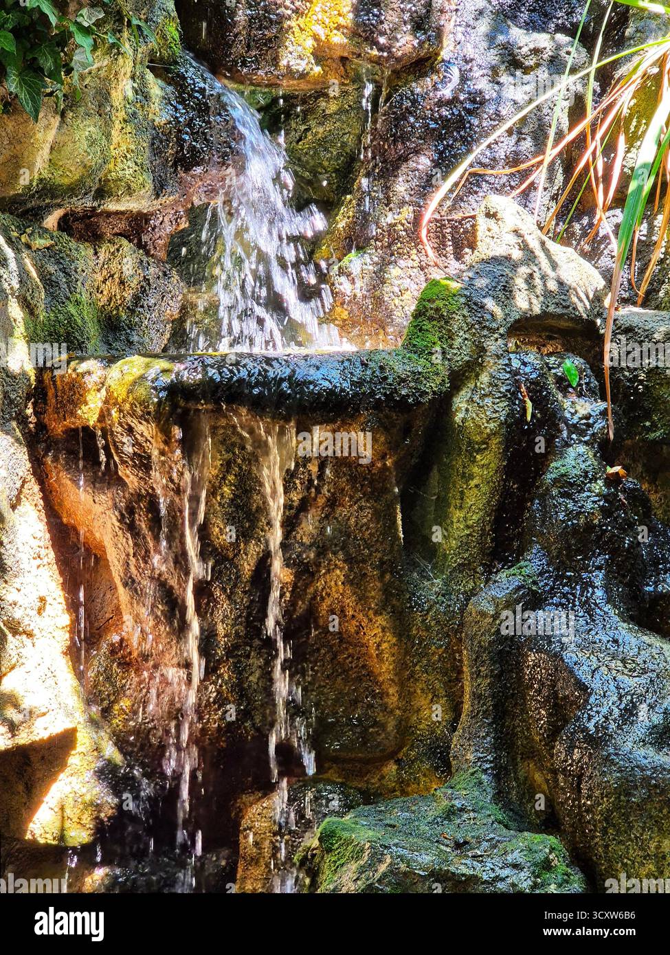 waterfall, falling water. piece fountain, waterfall. piece of decorative element - Smartphone Captured Stock Image